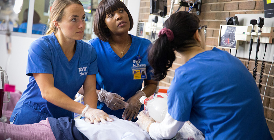 Nurses practicing resuscitation on simulated patient Nurses practicing resuscitation on simulated patient
