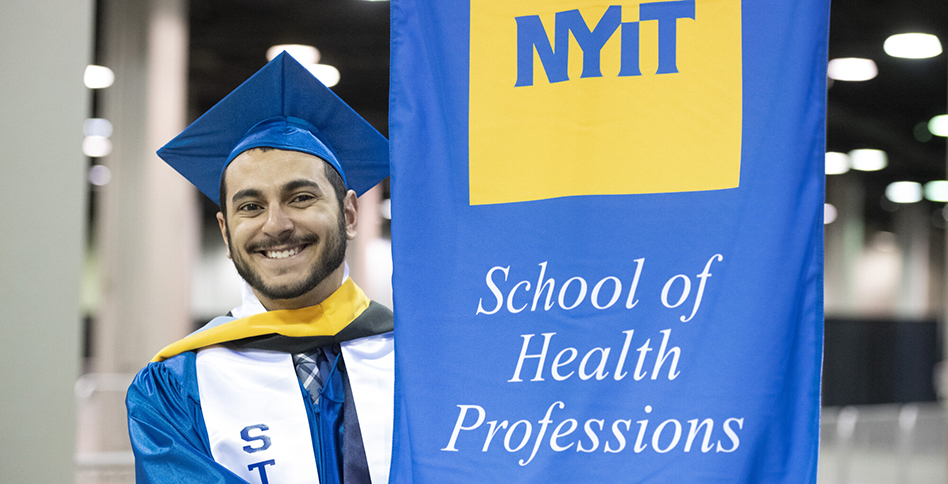 Graduate holding School of Health Professions sign for processional