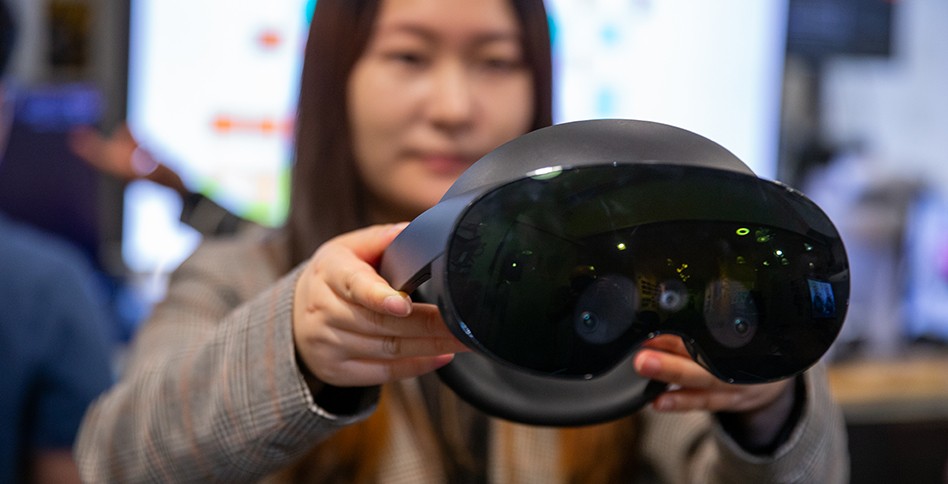 Woman holding VR goggles