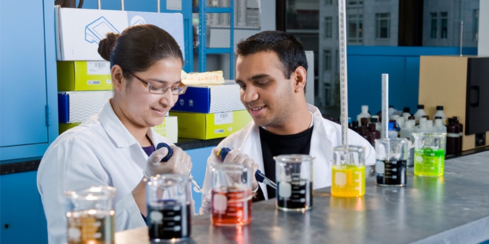 Students working with liquids in a lab.