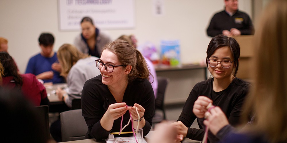Students talking around table