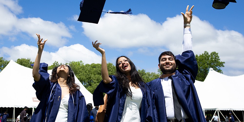 Students throwing graduation caps