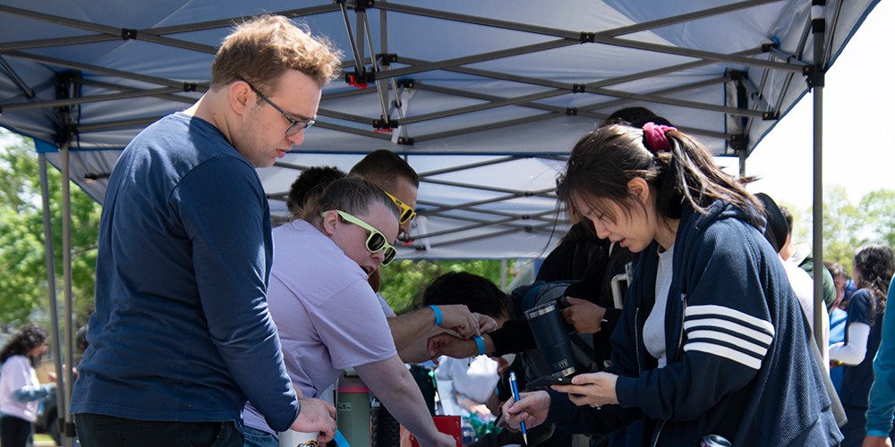 Student registering at table