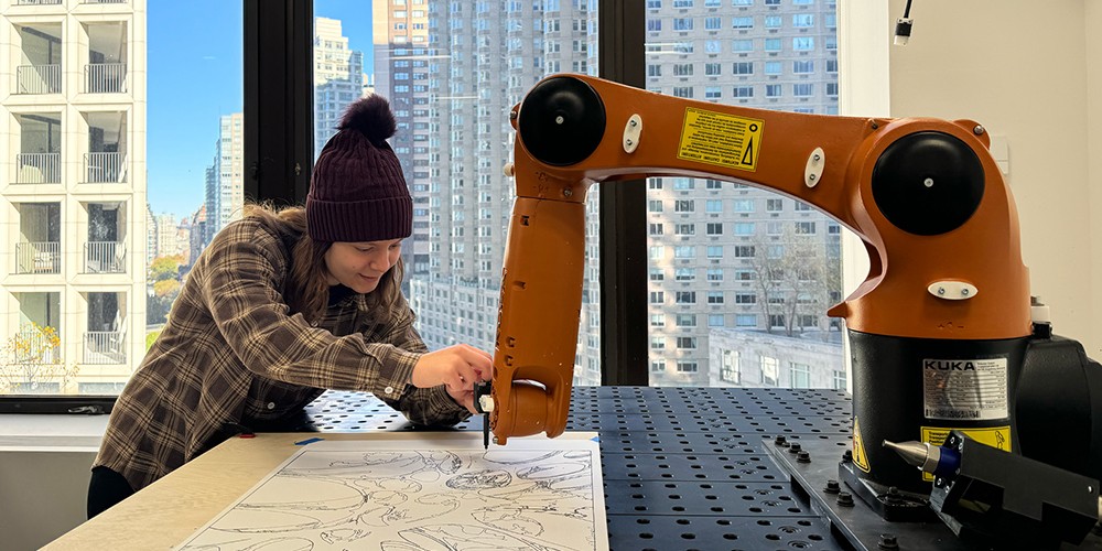 Student using robotic arm