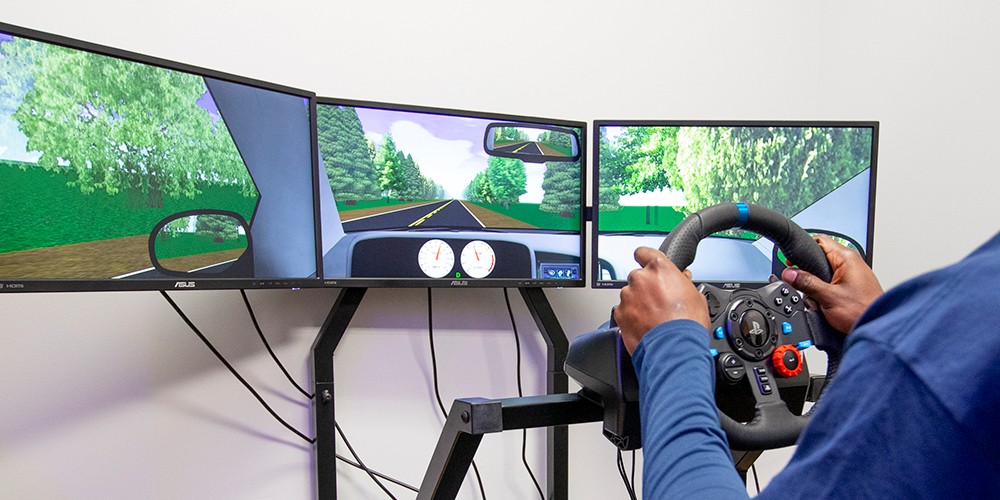 Hands holding steering wheel for test