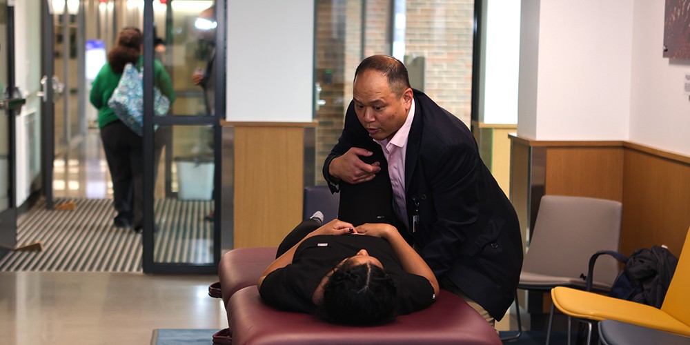 Faculty manipulating student in demo