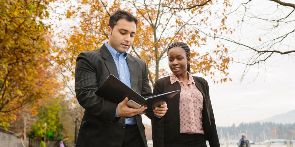 Business people in suits talking with each other