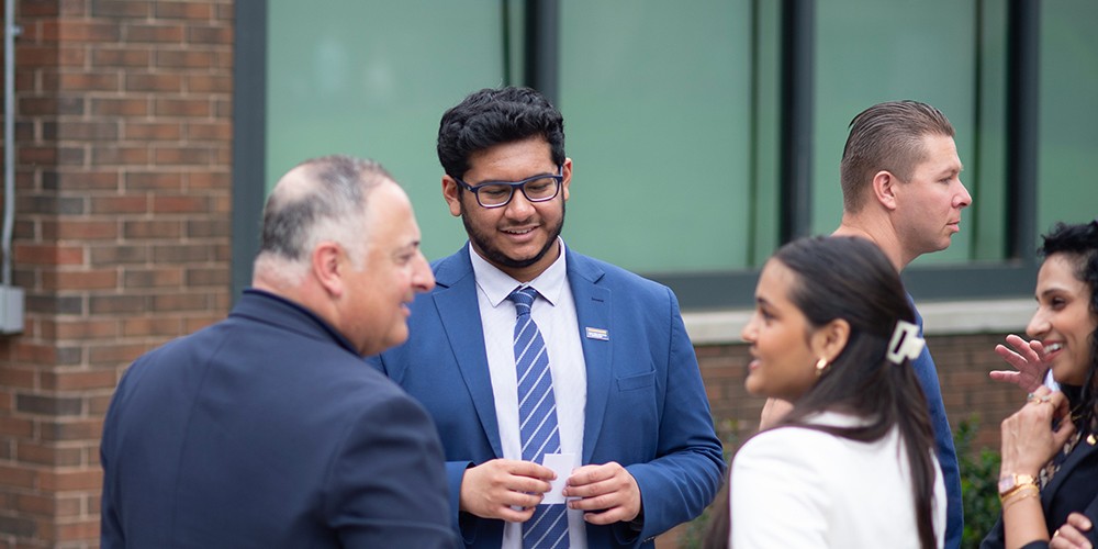 Three people talking